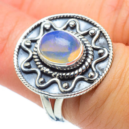 Sterling silver ring with oval Ethiopian opal cabochon in ornate bezel setting