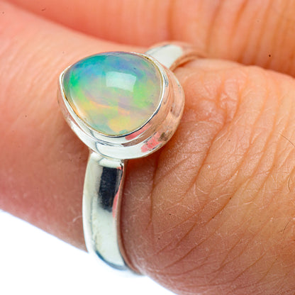 Sterling silver opal ring with oval bezel-set Ethiopian opal, green fire.