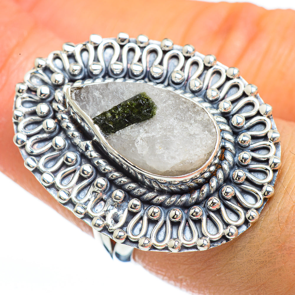 Sterling silver ring with oval quartz setting, green tourmaline, and beaded halo