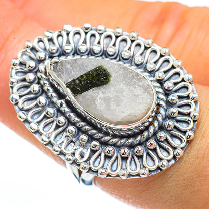 Sterling silver ring with oval quartz setting, green tourmaline, and beaded halo