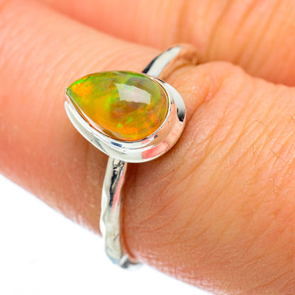 Sterling silver opal ring with oval green-orange Ethiopian opal, side view