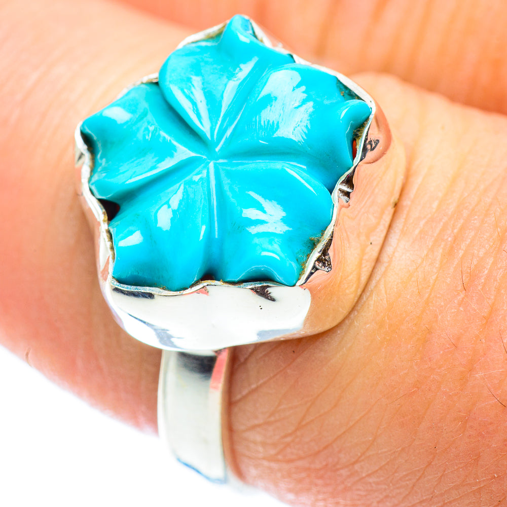 Turquoise flower detail on sterling silver band ring with textured metal border