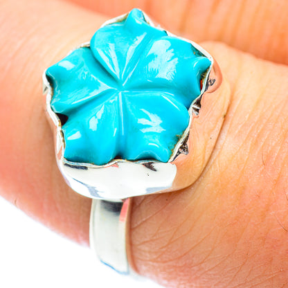 Turquoise flower detail on sterling silver band ring with textured metal border