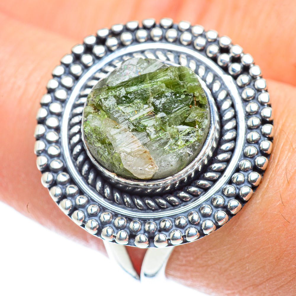 Sterling silver ring with green quartz cabochon and engraved oval bezel, beaded edge