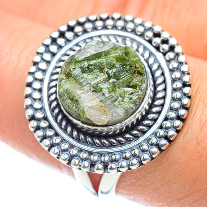 Sterling silver ring with green quartz cabochon and engraved oval bezel, beaded edge