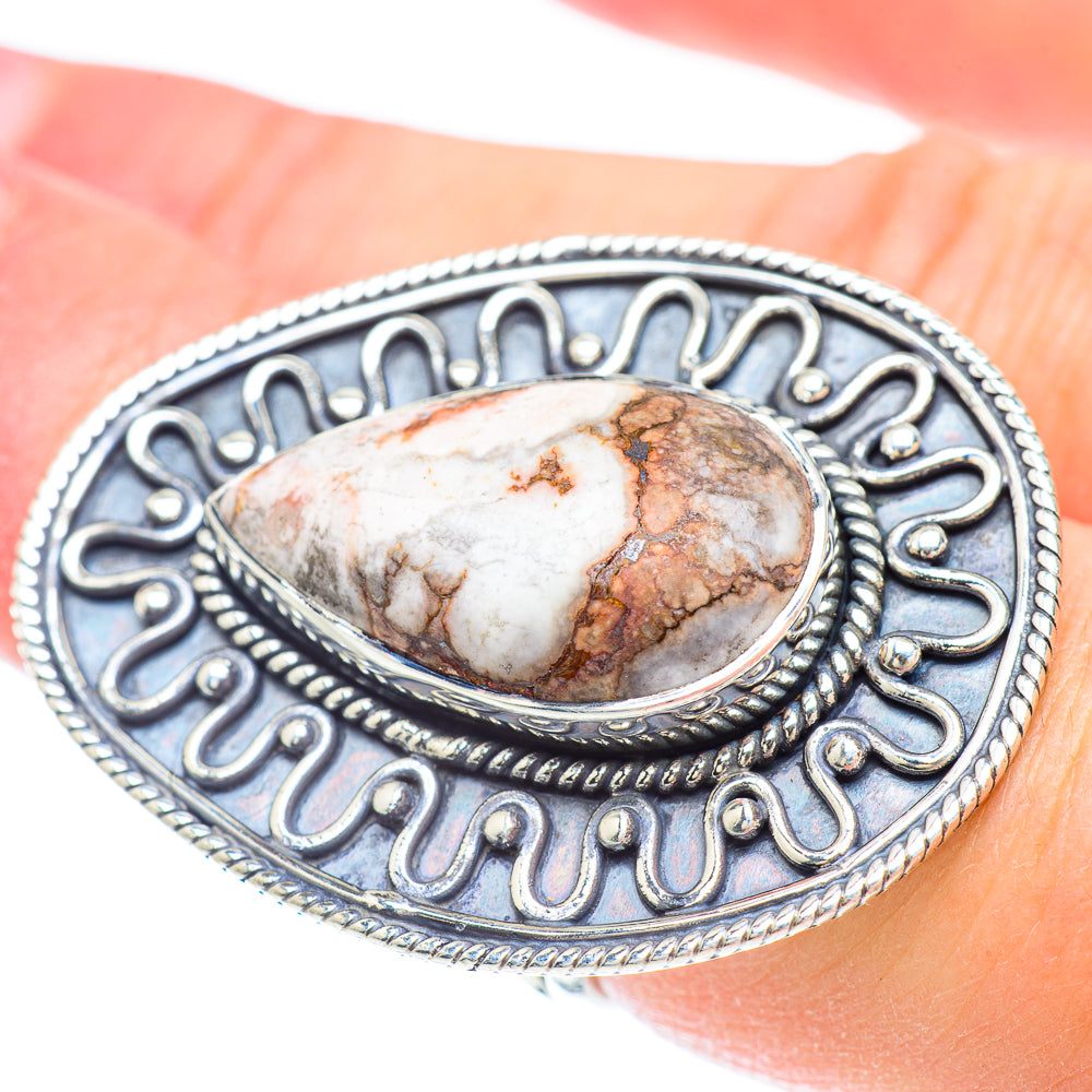 Sterling silver oval jasper gemstone ring with ornate frame and textured edge