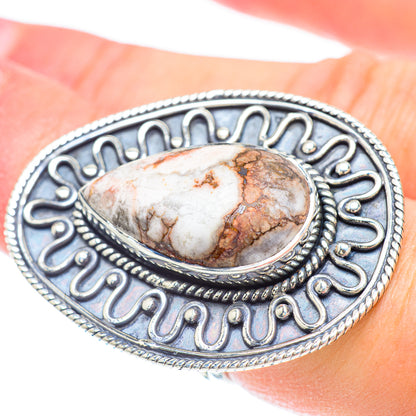 Sterling silver oval jasper gemstone ring with ornate frame and textured edge