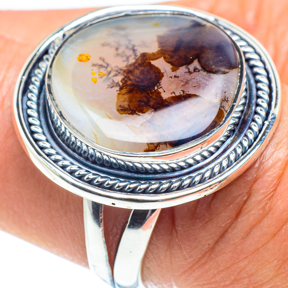 Sterling silver agate ring with oval cabochon; rope-like bezel and dark marbled stone