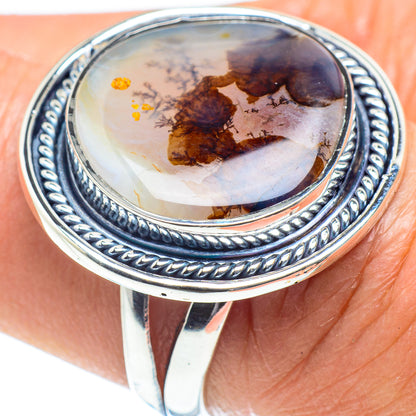 Sterling silver agate ring with oval cabochon; rope-like bezel and dark marbled stone