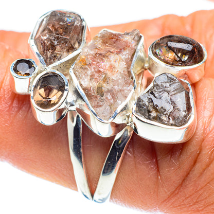 Sterling silver ring with mixed clear and smoky quartz stones in bezel settings