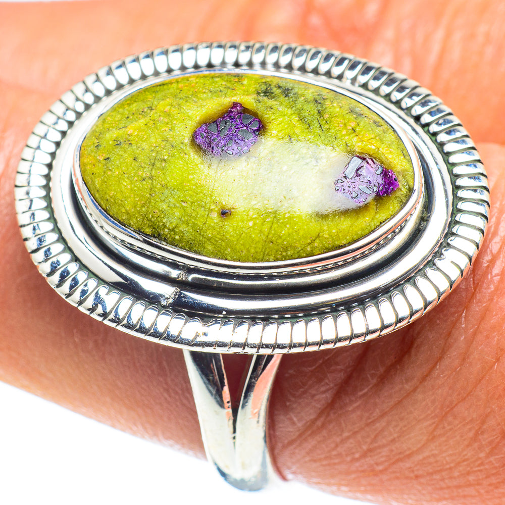 Sterling silver oval ring with textured bezel and green stone with purple specks