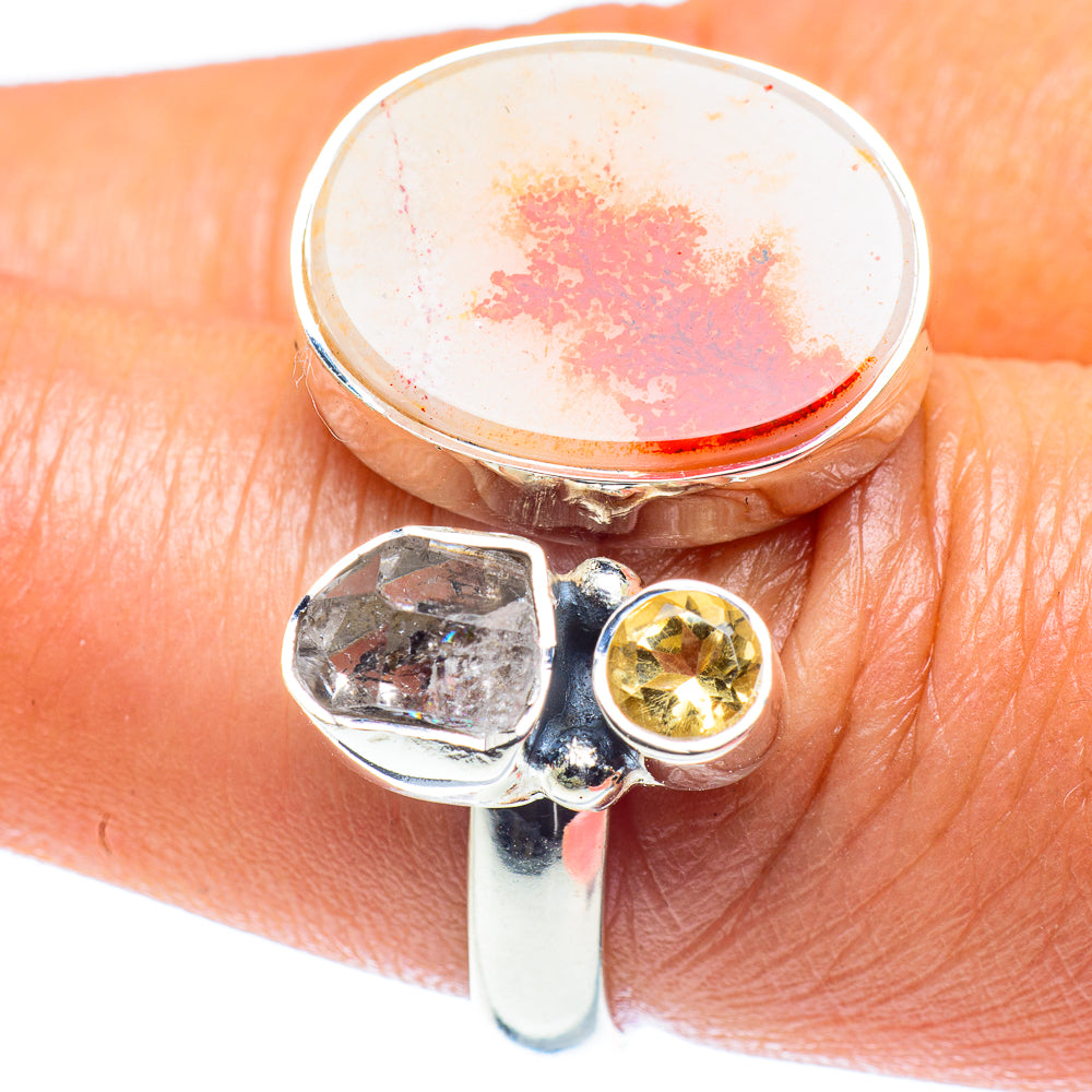 Adjustable sterling silver ring with round orange dendritic stone, small yellow crystal bezel