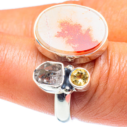 Adjustable sterling silver ring with round orange dendritic stone, small yellow crystal bezel