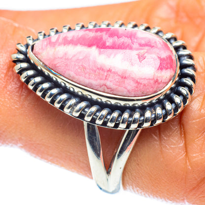 Sterling silver ring detail with pink teardrop stone and braided edge