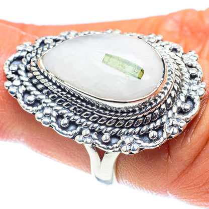 Sterling silver ring with oval white quartz centerpiece and green tourmaline stripe