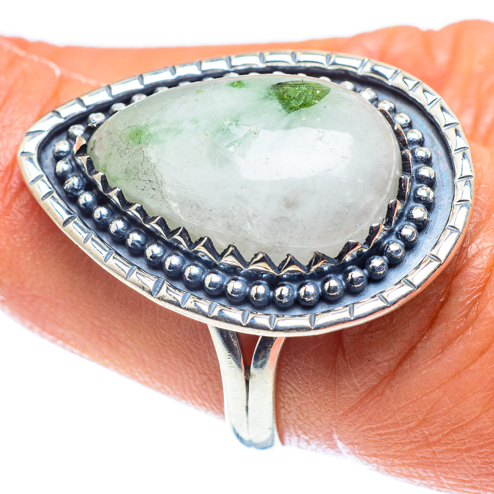 Sterling silver oval ring with green stone in bezel with beaded edge