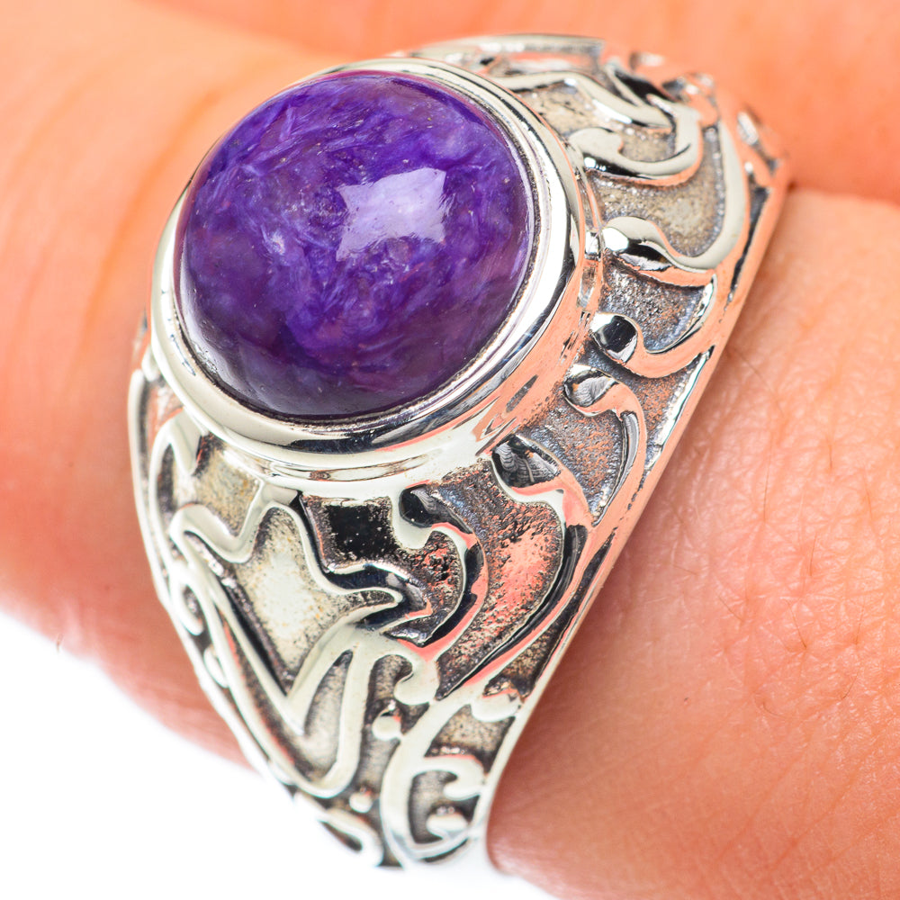 Sterling silver ring with large round purple charoite cabochon and ornate swirl setting
