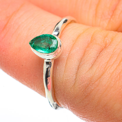 Sterling silver ring with oval green gemstone and split prongs