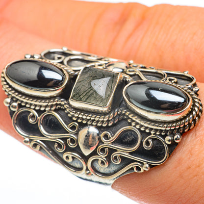 Sterling silver ring with filigree settings, dark hematite ovals, and green quartz rectangle