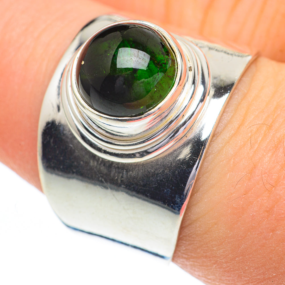 Sterling silver ring with green tourmaline cabochon and layered swirl metal bands