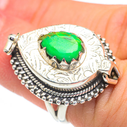 Sterling silver ring with large green oval cabochon stone in ornate bezel