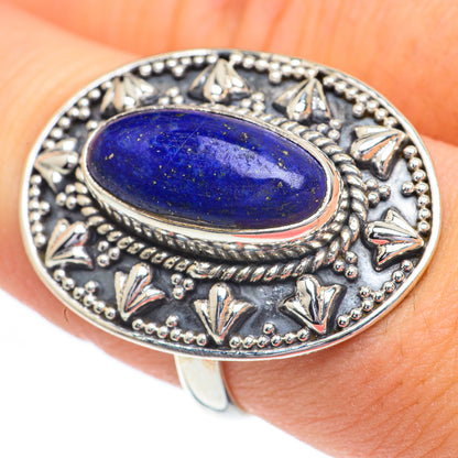 Lapis lazuli oval ring with rope border and cutout motifs on silver band