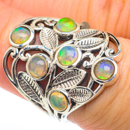 Sterling silver ring with round opal-style stones and leaf/feather accents