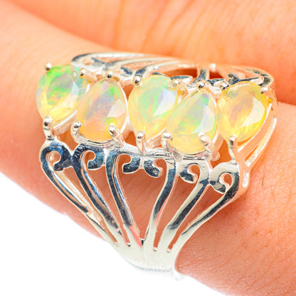 Sterling silver ring with three faceted opal stones in gold-toned setting