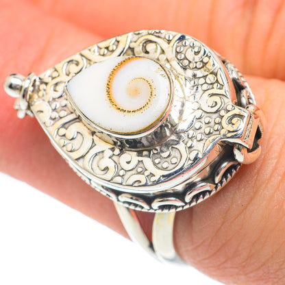 Sterling silver engraved eye ring with oval white cabochon, worn on finger