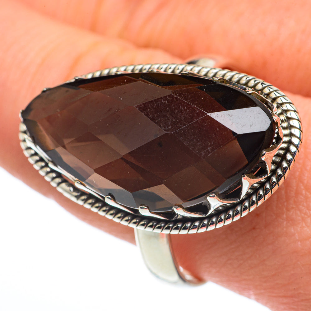 Smoky quartz marquise ring with dark brown faceted stone and braided silver frame