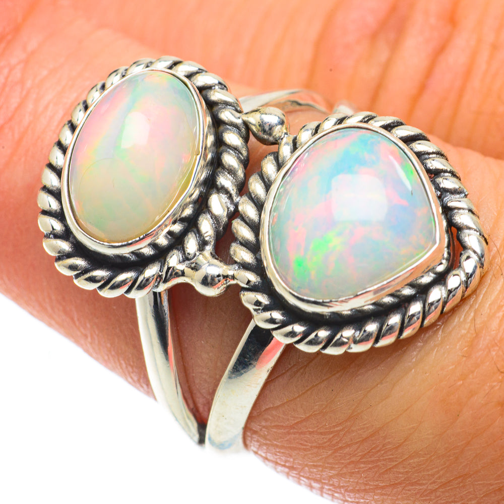 Sterling silver opal ring with two oval opal cabochons in rope-textured settings