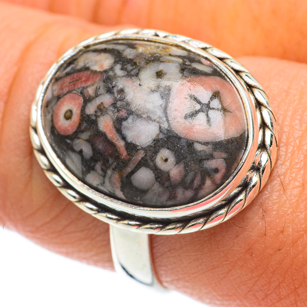 Sterling silver crinoid fossil ring, oval bezel with dark gray pattern and star-like marks