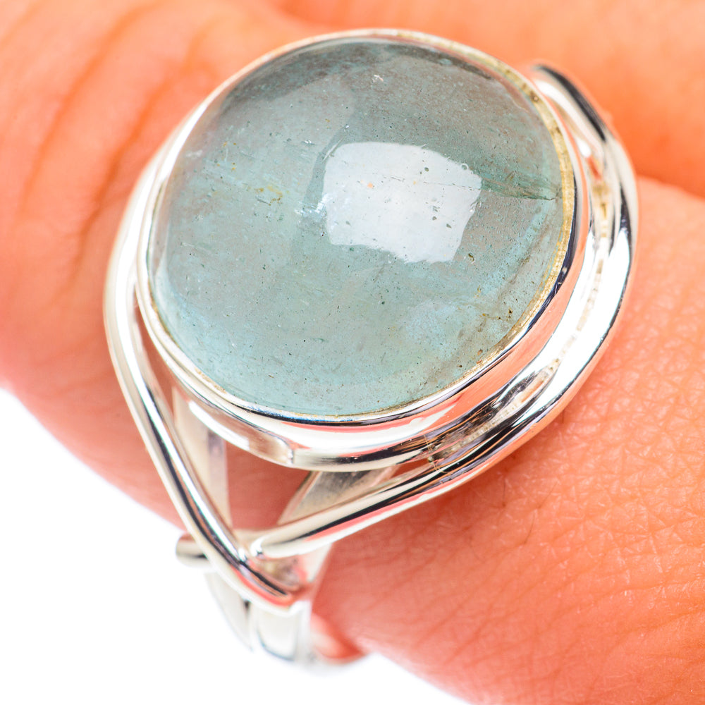 Aquamarine ring with oval light-blue cabochon and polished 925 sterling silver band
