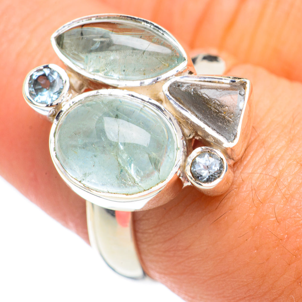 Sterling silver adjustable ring with two large oval aqua gemstones and two round accents