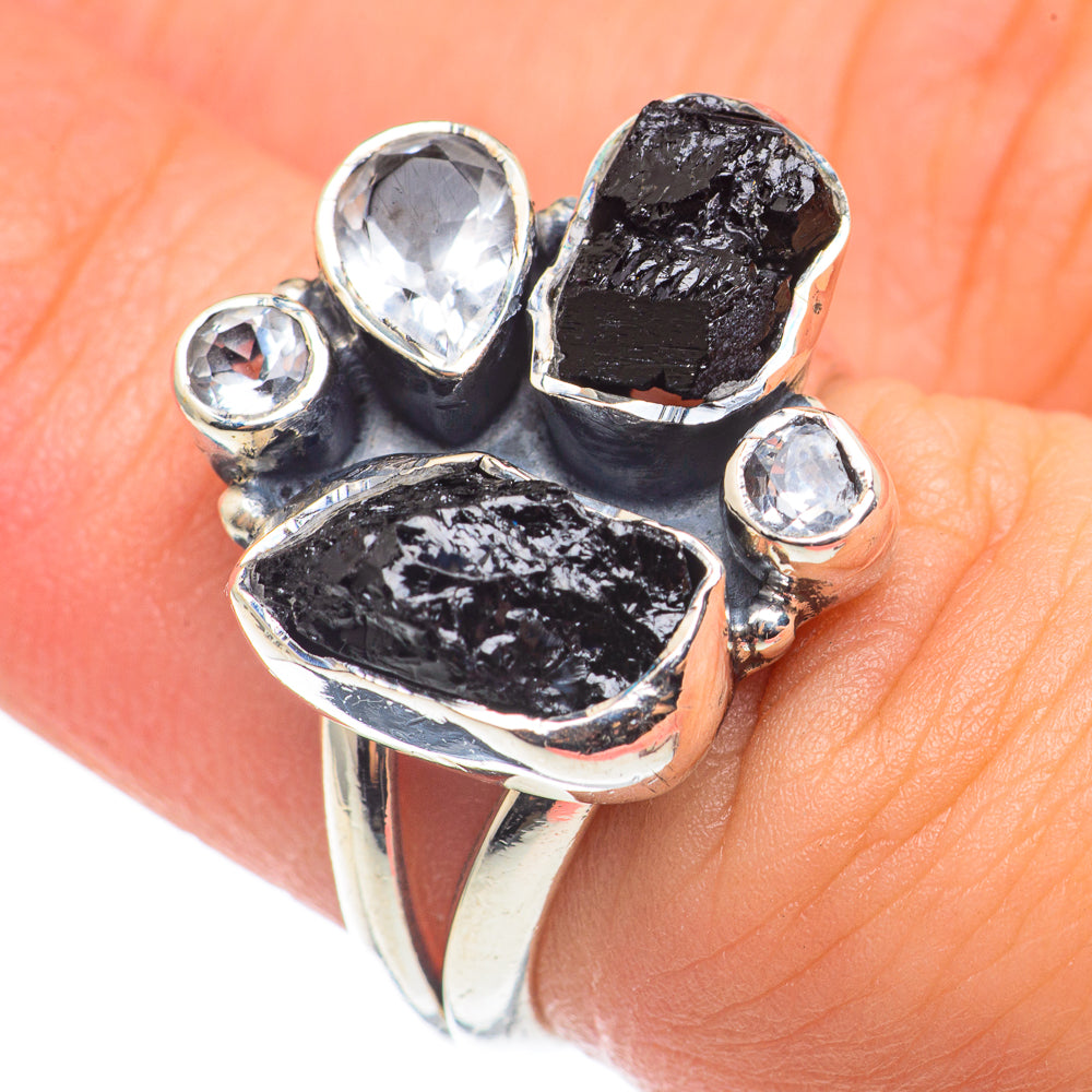 Sterling silver ring with rough black onyx and clear stone accents, oval top