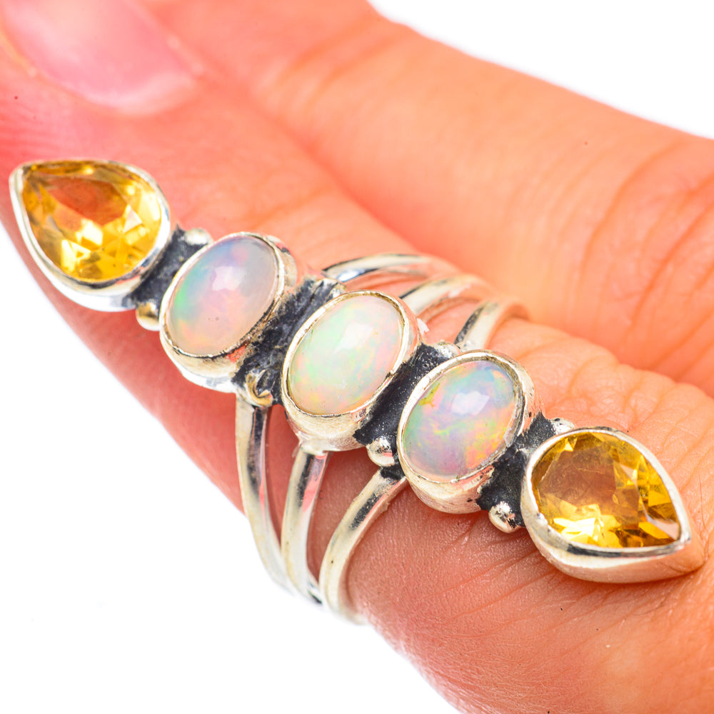 Sterling silver ring with oval opal and marquise citrine stones in a scalloped bezel setting
