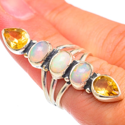 Sterling silver ring with oval opal and marquise citrine stones in a scalloped bezel setting