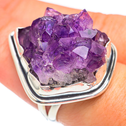Amethyst crystal ring on finger, large purple crystal cluster in silver setting