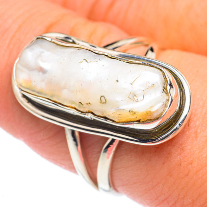 Sterling silver mother-of-pearl ring with oval bezel, pearlescent stone with gold-toned flecks