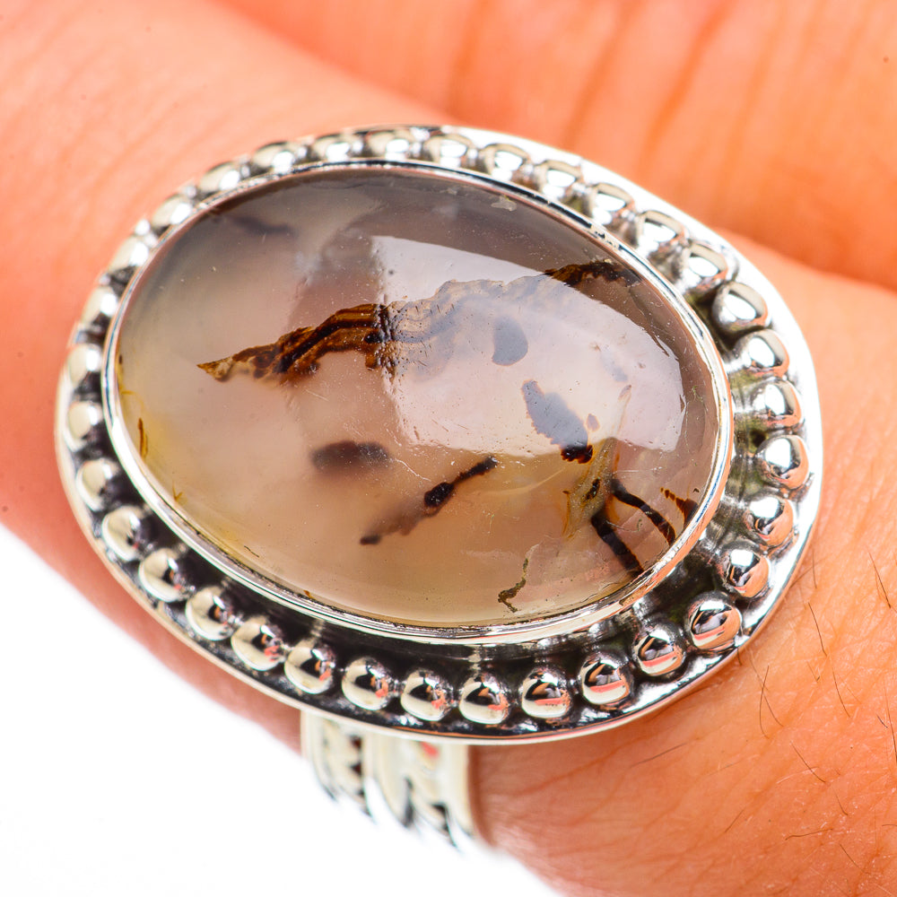 Sterling silver oval agate ring with dark branching inclusions in a bezel setting