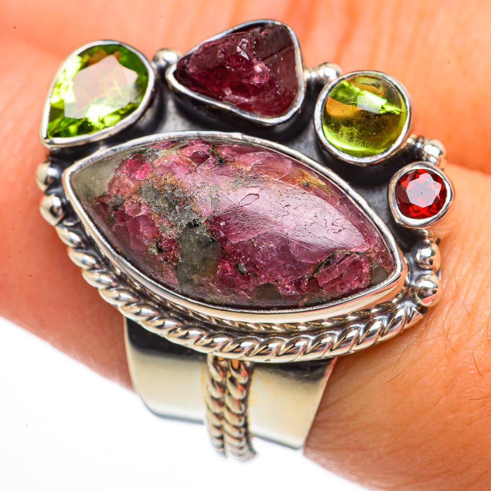 Sterling silver gemstone ring with large oval purple-red centerpiece and green round stones
