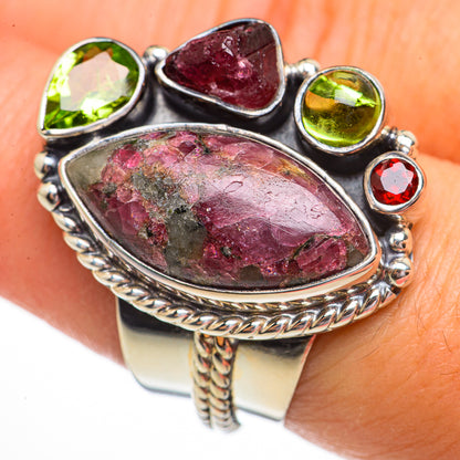 Sterling silver gemstone ring with large oval purple-red centerpiece and green round stones