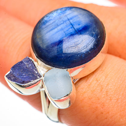 Sterling silver gemstone ring featuring large blue oval cabochon, purple rough, light-blue bezel