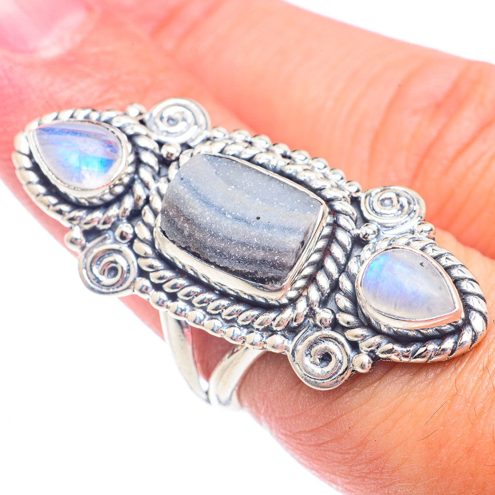 Sterling silver statement ring, side view with two oval opalescent stones and center bar