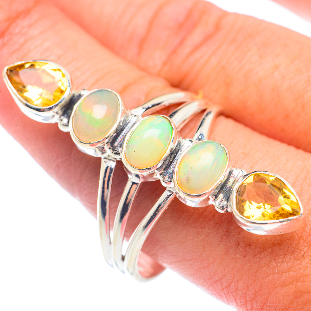 Sterling silver ring with four opal-like ovals and two yellow teardrops