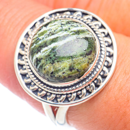 Sterling silver ring with oval green jasper cabochon and ornate engraved bezel
