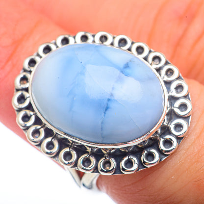 Sterling silver opal ring, oval sky-blue cabochon with scalloped circular bezel detail