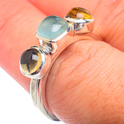 Sterling silver gemstone ring with blue-green aquamarine and yellow citrine on band