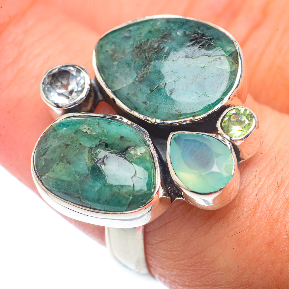 Sterling silver ring with three oval green gemstones and small round clear and green stones