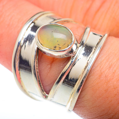 Sterling silver opal ring with oval yellow-green opal cabochon